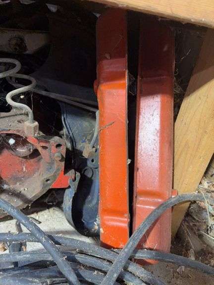 Bucket of hydraulic oil, extension cord, gas nozzles, and more