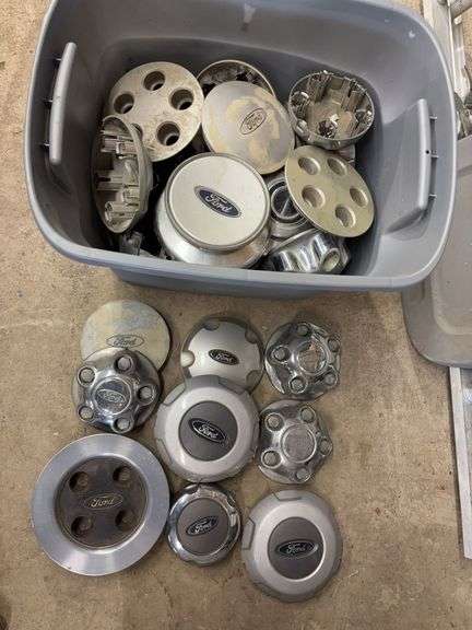 Tote of Ford hub caps and parts