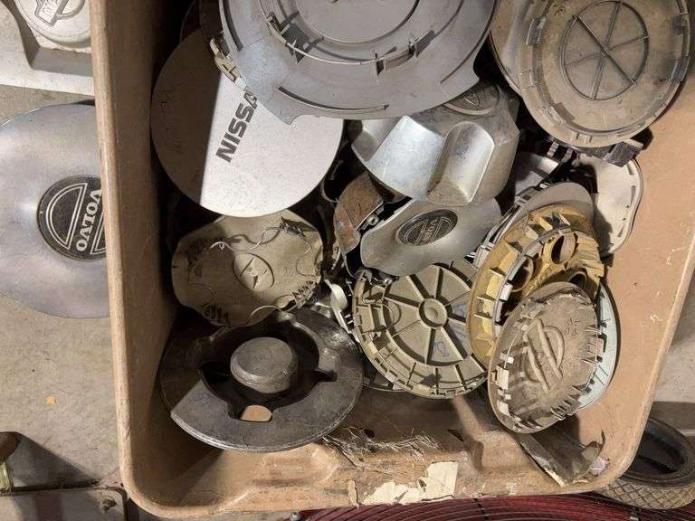 Large tote of miscellaneous hub caps and parts -Volvo, Nissan, Honda, BMW and more