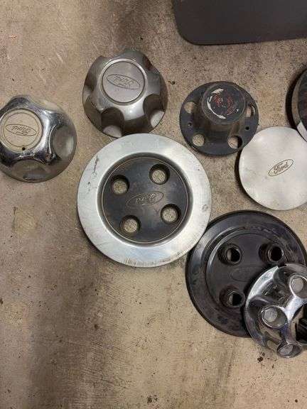 Tote of Ford hub caps and parts