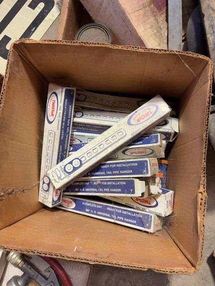 Large assortment of car parts, office supplies, and miscellaneous