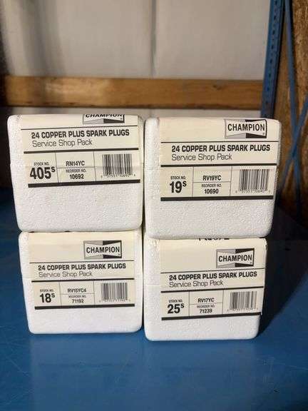 (4) Champion boxes of 24 copper plus spark plugs