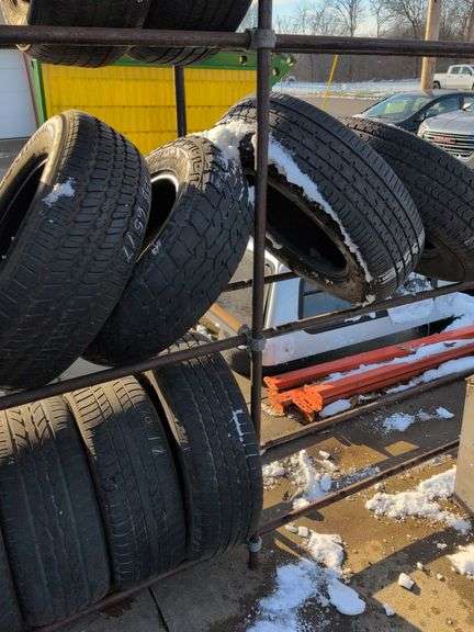 Metal tire rack - 21' x 18" x 7' - stored outside, contents not included