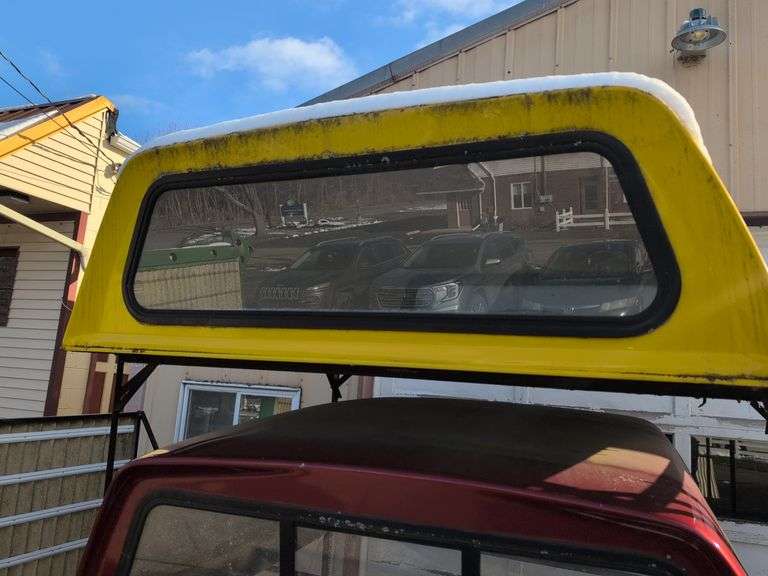 Yellow truckbed cap for a Dodge - 6' wide, 79" long