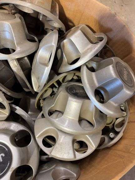 Assortment of hub caps including Jeep, Buick, and Chevy -see photos