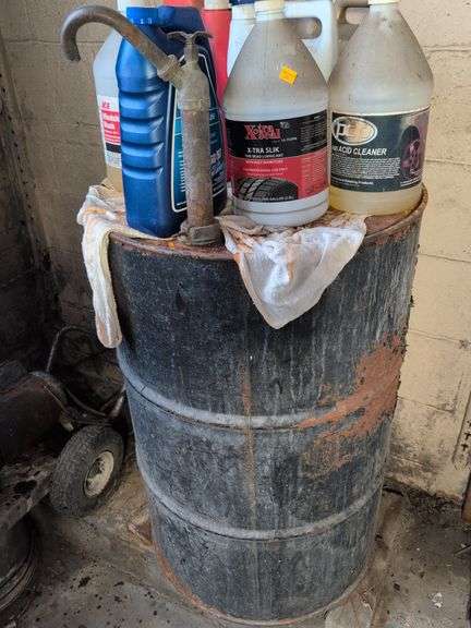 55 gallon metal drum with some antifreeze