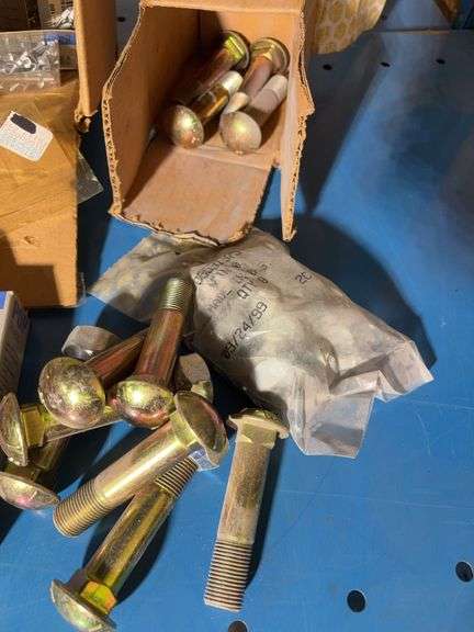 Box of pop rivets mostly unopened, Arrow staples, New Holland parts and more