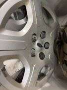 Large tote of hub caps and parts -Pontiac, Chrysler and more