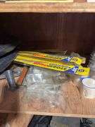 Contents of cabinet - oil filters, wiper blades, CB radios, manuals, and more