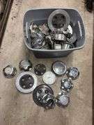 Tote of Ford hub caps and parts