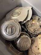 Tote of Miscellaneous hub caps and parts -see photos