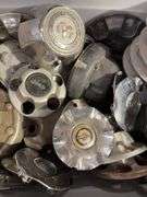 Large tote of hub caps and parts - Mostly Ram -see photos