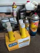 Assortment of mechanic fluids and some tools