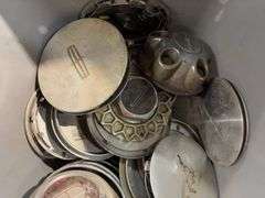 Tote of hubcaps/center caps - mostly Ford