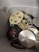 Tote of Chevy hub caps and parts