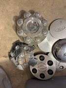 Tote of miscellaneous hub caps and parts -including Ford, Chevy and more - see photos