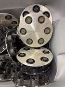 Tote of Chevy hub caps and parts