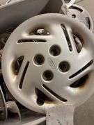 Large tote of hub caps and parts -Pontiac, Chrysler and more