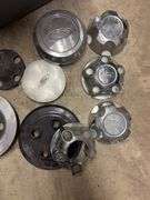 Tote of Ford hub caps and parts