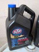 Assortment of motor oil and other vehicle fluids - most partially full