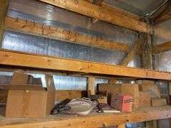 Shelf of miscellaneous car parts and other items