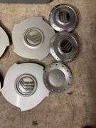 Tote of Miscellaneous hub caps and parts -see photos