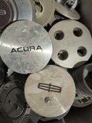 Tote of hubcaps/center caps - Acura, Nissan, Ram, and many more