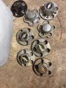 Tote of Chevy hub caps and parts