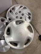 Tote of miscellaneous hub caps and parts -Ford, Toyota and more