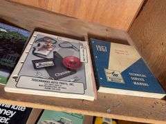 Contents of cabinet - oil filters, wiper blades, CB radios, manuals, and more