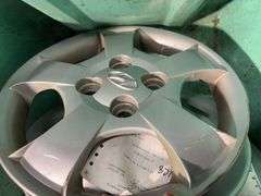 Large tote of hub caps and parts -Hyundai, Eagle and more