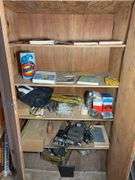 Contents of cabinet - oil filters, wiper blades, CB radios, manuals, and more