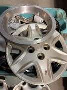 Large tote of hub caps and parts -Honda, Mazda, Nissan and more