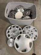 Tote of miscellaneous hub caps and parts -Ford, Toyota and more