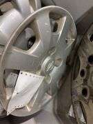 Large tote of hub caps and parts -Pontiac, Chrysler and more