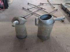 (2) metal oil cans/pitchers