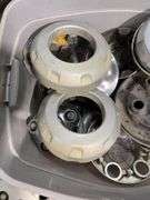 Tote of hub caps and parts -Nissan, Chevy, Ford and more