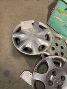 Large tote of hub caps and parts -Hyundai, Eagle and more