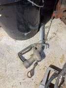 Bucket of hydraulic oil, extension cord, gas nozzles, and more