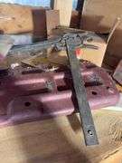 Shelf of miscellaneous car parts and other items