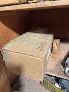 Contents of cabinet - oil filters, wiper blades, CB radios, manuals, and more