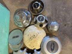 Large tote of miscellaneous hub caps and parts -Jeep, Lincoln, Ford and more