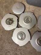 Tote of Miscellaneous hub caps and parts -see photos