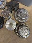 Large tote of hub caps and parts - Mostly Ram -see photos