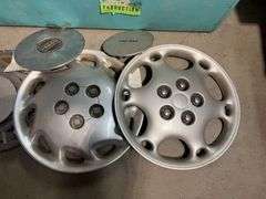 Large tote of hub caps and parts -Honda, Mazda, Nissan and more