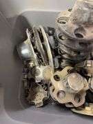 Tote of Chevy hub caps and parts