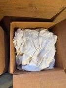 Boxes of rags, military bag, and blankets