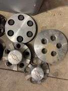 Tote of Chevy hub caps and parts