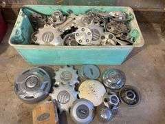 Large tote of miscellaneous hub caps and parts -Jeep, Lincoln, Ford and more