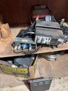 Contents of cabinet - oil filters, wiper blades, CB radios, manuals, and more